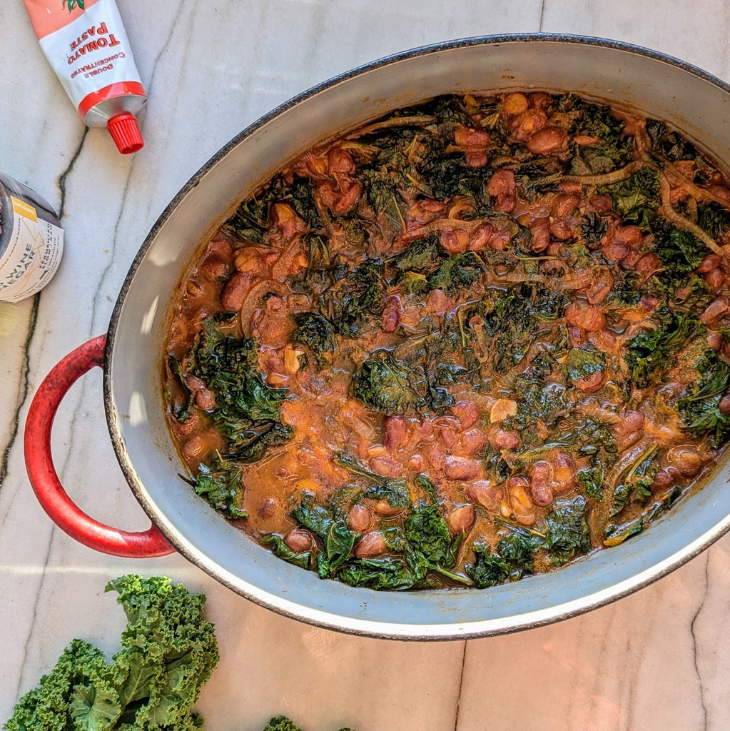 Beans and kale stew in pot